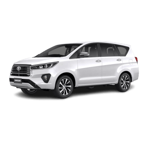 A white Toyota Innova Crysta taxi in Varanasi
