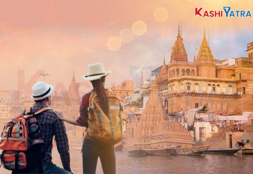 A couple standing together with the ghats of Varanasi behind them