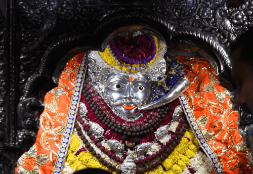 Close view of the silver face of Baba Kal Bhairav in Varanasi