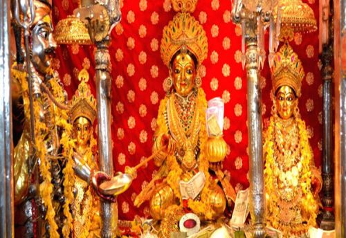 The golden form of Annapurna Devi with accompanying deities