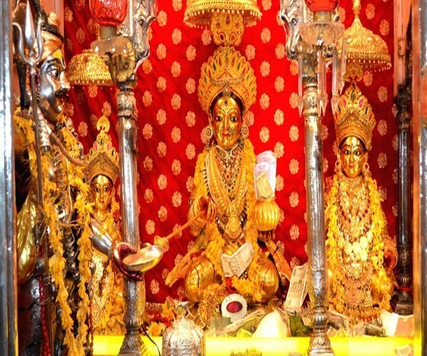The golden image of Annapurna Devi with accompanying deities in Varanasi