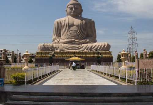 The 80-foot Great Buddha statue at Bodh Gaya seated in meditation, viewed from the garden path