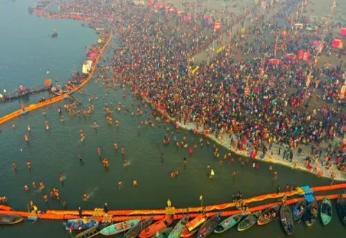 Pilgrims and boats at the Triveni Sangam in Prayagraj