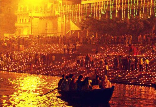 Illuminated diyas along a ghat during Dev Diwali